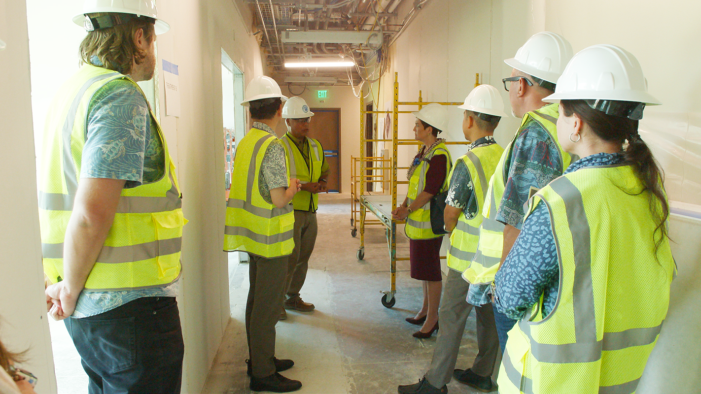 UH President Wendy Hensel with UH Cancer Center faculty and staff in the future Hoʻola space